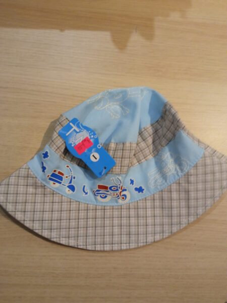 Platmale gaiši zila ar gaiši brūnām-baltām rūtiņām, ar motociklu un motorolleri 54-56 izmērs