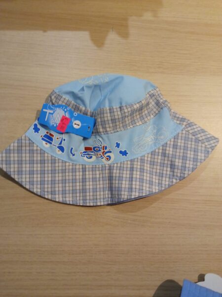 Platmale gaiši zila ar zili-gaiši brūnām rūtiņām, ar motociklu un motorolleri 54-56 izmērs