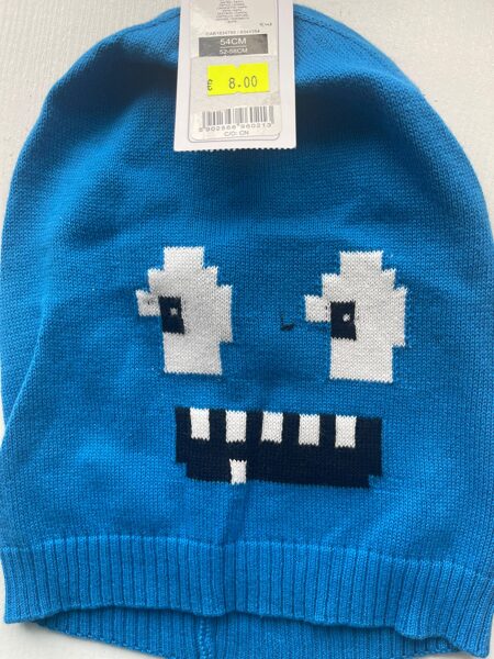 Puišu cepure/plāna-adīta/ gaiši zila ar acīm un zobiem/ platums 20 cm/dziļums 23 cm